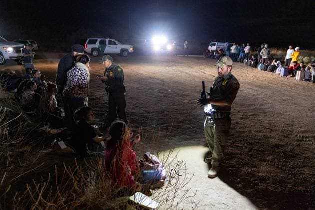 JACUMBA HOT SPRINGS, CA - JUNE 24: Migrants are processed by U.S. Border Patrol agents after crossing into U.S. from Mexico through an abandoned railroad on June 24, 2024 in Jacumba Hot Springs, San Diego, California.  Copyright: xVCGx 111503898901