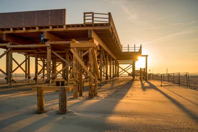 Germany, Schleswig-Holstein, St. Peter-Ording, Empty pier at sunset, FRF01036