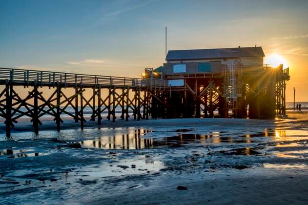 Germany, Schleswig-Holstein, St. Peter-Ording, Empty pier at sunset, FRF01039