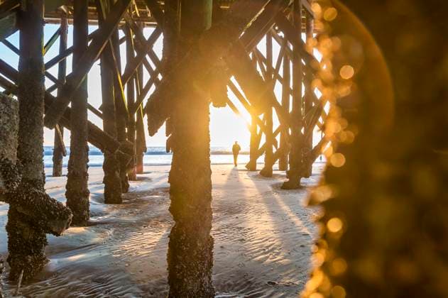 Germany, Schleswig-Holstein, St. Peter-Ording, Underside of pier at sunset model released, Symbolfoto, FRF01041