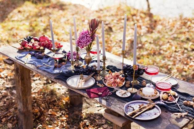 Various food with red wineglasses and candles decorated for thanksgiving at dinner table, ONAF00885
