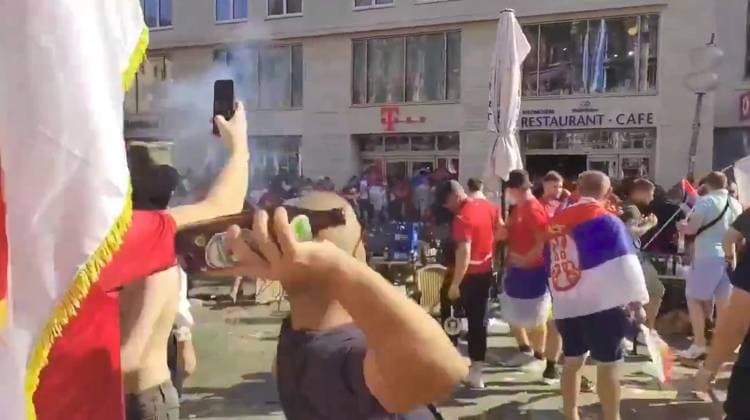 VIDEO: Serbian footy thugs lob beer bottles at German cops in ugly Euro 2024 scenes Story from Jam Press (Serbian Fans Throw Bottles) Pictured: A video grab of Serbian football thugs lobbing beer bottles at German riot cops. VIDEO: Serbian footy thugs lob beer bottles at German cops in ugly Euro 2024 scenes Serbian football thugs lobbed beer bottles at German riot cops in ugly scenes at Euro 2024. A mob of supporters targeted the police officers in the main square in Munich. It was ahead of their match last (25 Jun) night with Denmark that ended 0-0. Serbia, in Group C along with England, were knocked out after finishing bottom. Some of their fans were topless, while others were clad in their football shirts and draped in their nati  Copyright: xJamxPressxVid @footbalIfights