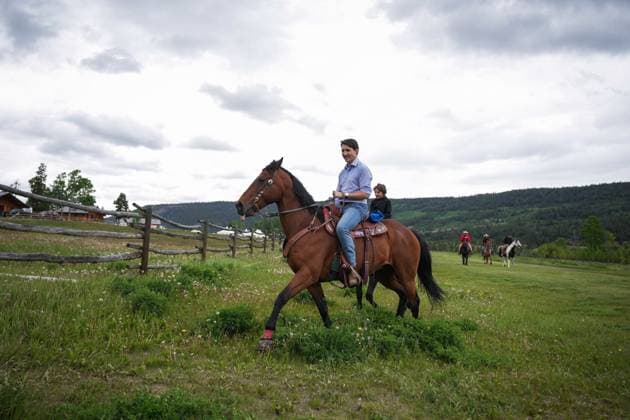June 26, 2024, Nemaiah Valley, Bc, CANADA: Prime Minister Justin Trudeau and his son Hadrien, 10, ride horses while attending community celebrations to mark the 10th anniversary of the Tsilhqot in decision, in Nemaiah Valley, B.C., on Wednesday, June 26, 2024. In 2014, the Supreme Court of Canada granted Tsilhqot in aboriginal title to more than 1,750 square kilometres of land in the Nemaiah Valley. Nemaiah Valley CANADA - ZUMAc35_ 20240626_zaf_c35_137 Copyright: xDarrylxDyckx