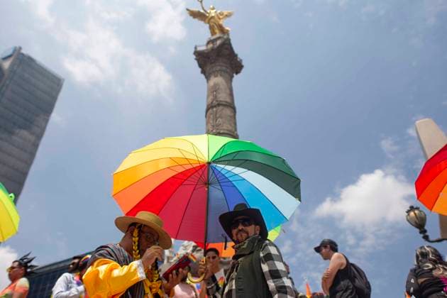 June 29, 2024, Mexico City, Mexico City, Mexico: Citizens attending the LGBT+ Pride March in Mexico City posing for a photo at the foot of the Angel de la Independencia. Mexico City Mexico - ZUMAs310 20240629_zip_s310_002 Copyright: xLuisxExSalgadox