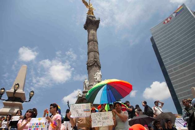June 29, 2024, Mexico City, Mexico City, Mexico: Citizens attending the LGBT+ Pride March in Mexico City posing for a photo at the foot of the Angel de la Independencia. Mexico City Mexico - ZUMAs310 20240629_zip_s310_018 Copyright: xLuisxExSalgadox