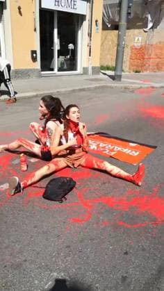 BOLOGNA - THE TOUR DE FRANCE BLOCKED IN SUPPORT OF YOUNG PALESTINIANS, AGAINST the sportwhasing of Israel Premier Tech, the Israeli team participating in the Tuor. This afternoon, five people adhering to the Latest Generation Repair Fund campaign occupied the road under the bridge of the Mazzini station, sitting down, chaining themselves together and pouring red paint on themselves and on the street, to symbolize blood Editorial Usage Only  Copyright: xUltimaxGenerazione Fotogrammax xIPAx Agenzia_Fotogramma_FGR4130912