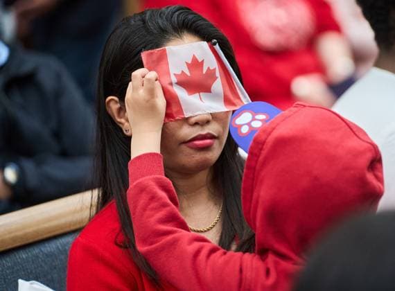 July 1, 2024, Winnipeg, Mb, Canada: Six-year-old Kale plays with a Canadian flag with his mother, Marilou Martin, originally from the Philippines, during a Canada Day citizenship ceremony at the Assiniboine Park Pavilion in Winnipeg, Man., Monday July 1, 2024. Winnipeg Canada - ZUMAc35_ 20240701_zaf_c35_052 Copyright: xDavidxLipnowskix