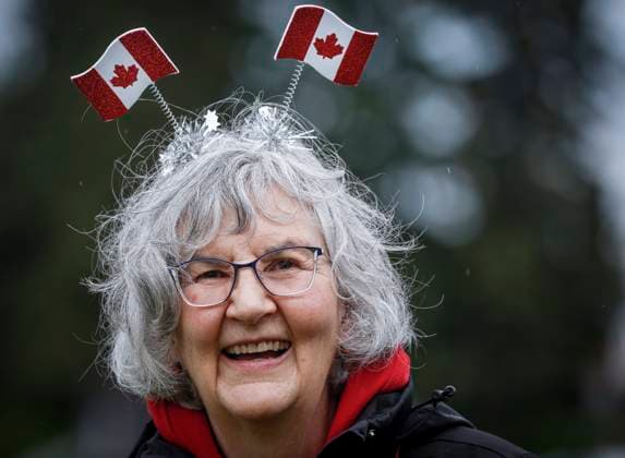 July 1, 2024, Cremona, Ab, CANADA: Barbara MacFarquahar shows her patriotism despite the rain during Canada Day celebrations in Cremona, Alta., Monday, July 1, 2024. Cremona CANADA  - ZUMAc35_ 20240701_zaf_c35_164 Copyright: xJeffxMcintoshx