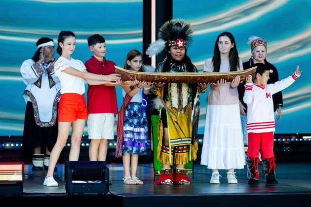 July 1, 2024, Ottawa, On, Canada: Canadian youth and Indigenous youth dancers are seen with a ceremonial canoe during Canada Day celebrations at LeBreton Flats in Ottawa, on Monday, July 1, 2024. Ottawa Canada  - ZUMAc35_ 20240701_zaf_c35_152 Copyright: xSpencerxColbyx