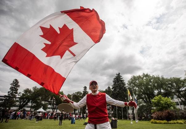 July 1, 2024, Edmonton, Ab, CANADA: Henry Stephens waves a flag during Canada Day celebrations in Edmonton on Monday July 1, 2024. Edmonton CANADA  - ZUMAc35_ 20240701_zaf_c35_163 Copyright: xJasonxFransonx