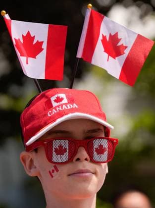 (240701) -- RICHMOND (CANADA), July 1, 2024 -- A boy is seen during the Canada Day Parade in Richmond, British Columbia, Canada, on July 1, 2024. (Photo by Xinhua) CANADA-RICHMOND-CANADA DAY-PARADE LiangxSen 