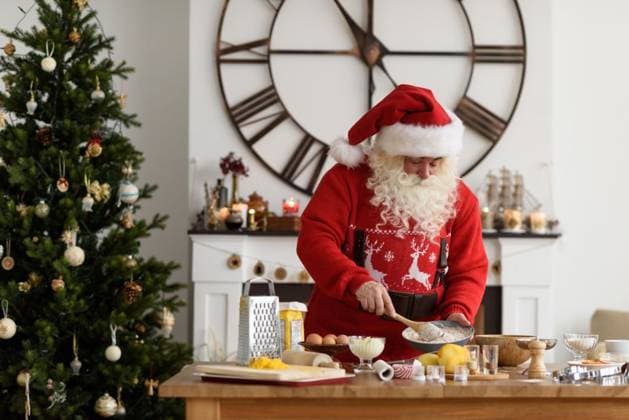 Santa Claus Cooking at Home Christmas Cookies ,model released, Symbolfoto