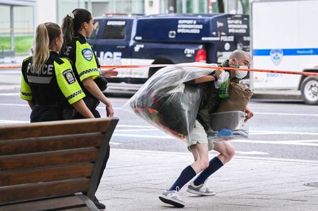 July 5, 2024, Montreal, Pq, Canada: Police escort a person away from a pro-Palestine protest encampment in Montreal, Friday, July 5, 2024. Montreal Canada  - ZUMAc35_ 20240705_zaf_c35_002 Copyright: xGrahamxHughesx