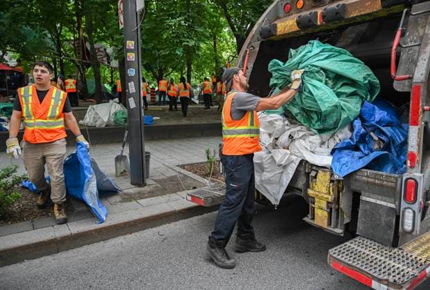 July 5, 2024, Montreal, Pq, Canada: City workers dismantle tents after police cleared a pro-Palestinian protest encampment in Victoria Square in Montreal, Friday, July 5, 2024. Montreal Canada  - ZUMAc35_ 20240705_zaf_c35_022 Copyright: xGrahamxHughesx