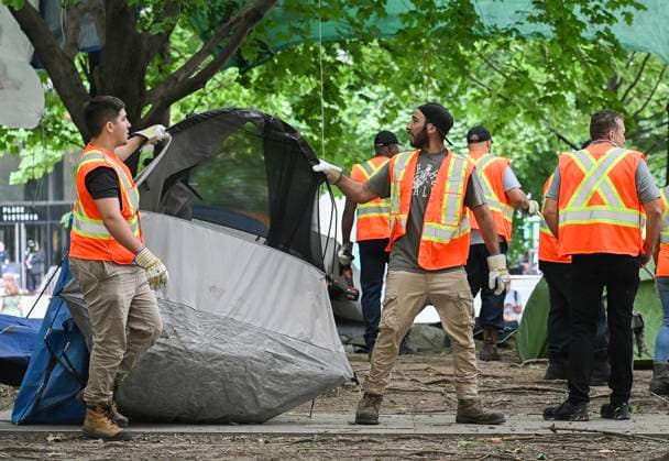 July 5, 2024, Montreal, Pq, Canada: City workers dismantle tents after police cleared a pro-Palestine protest encampment in Victoria Square in Montreal, Friday, July 5, 2024. Montreal Canada  - ZUMAc35_ 20240705_zaf_c35_023 Copyright: xGrahamxHughesx