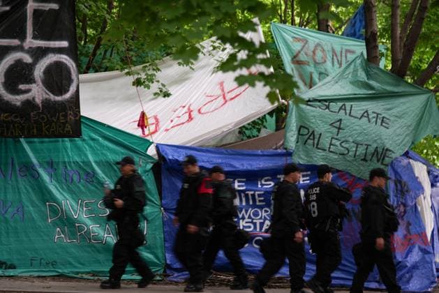 July 5, 2024, Montreal, Pq, CANADA: Police are seen outside a pro-Palestinian protest encampment in Victoria Square in Montreal, Friday, July 5, 2024. Montreal CANADA  - ZUMAc35_ 20240705_zaf_c35_037 Copyright: xChristinnexMuschix