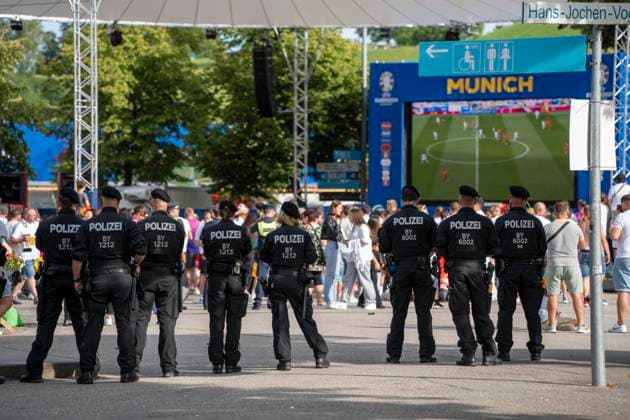 Munich, Bavaria, Germany - July 5, 2024: German, Bavarian police in the fan zone in Munich in the Olympic Park, guarding the soccer event during the soccer match between Germany and Spain, so that they can intervene quickly in case of conflicts and trouble.