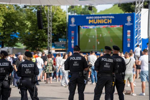 Munich, Bavaria, Germany - July 5, 2024: German, Bavarian police in the fan zone in Munich in the Olympic Park, guarding the soccer event during the soccer match between Germany and Spain, so that they can intervene quickly in case of conflicts and trouble.