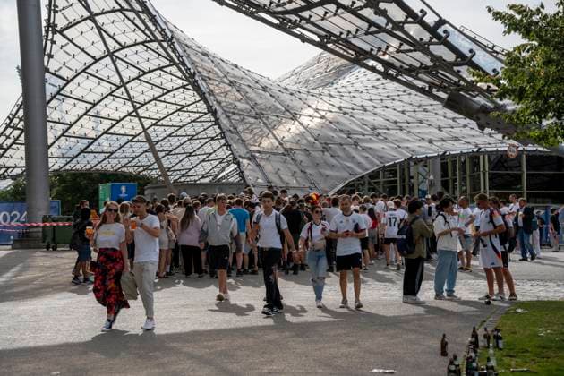 Munich, Bavaria, Germany - July 5, 2024: Many fans in crowd in front of the Olympic Stadium or Olympic Park at the entrance to the fan zone for the European Football Championship at the match between Germany and Spain.
