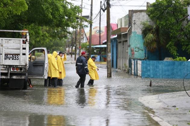 (240705) -- CANCUN (MEXICO), July 5, 2024 -- People inspect a flooded street after the landfall of Hurricane Beryl, in Cancun, Quintana Roo state, Mexico, on July 5, 2024. Over 1 million people in the Caribbean have been affected by Hurricane Beryl, UN humanitarians said Friday. As a category 4 hurricane that has claimed at least 11 lives so far, Beryl left a trail of destruction in Grenada and Saint Vincent and the Grenadines on Monday, then impacting Jamaica on Wednesday. The hurricane is currently affecting Belize and Mexico. (Photo by Xinhua) MEXICO-CANCUN-HURRICANE BERYL AlbertoxValdez