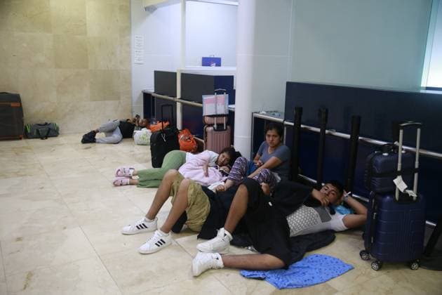 (240705) -- CANCUN (MEXICO), July 5, 2024 -- Travelers wait inside the Cancun International Airport after the arrival of Hurricane Beryl, in Cancun, Quintana Roo state, Mexico, on July 5, 2024. Over 1 million people in the Caribbean have been affected by Hurricane Beryl, UN humanitarians said Friday. As a category 4 hurricane that has claimed at least 11 lives so far, Beryl left a trail of destruction in Grenada and Saint Vincent and the Grenadines on Monday, then impacting Jamaica on Wednesday. The hurricane is currently affecting Belize and Mexico. (Photo by Xinhua) MEXICO-CANCUN-HURRICANE BERYL AlbertoxValdez