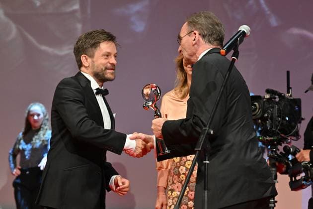 Director and actor Jiri Madl, left, receives the Pravo Audience Award for the film Waves at the closing awards ceremony of the 58th Karlovy Vary International Film Festival, in Karlovy Vary, Czech Republic, on July 6, 2024. The award was presented to him by Petr Sabata, editor-in-chief of the daily Pravo. (CTKxPhoto OndrejxHajek) CTKPhotoP2024070604783  CTKPhotoP2024070604783