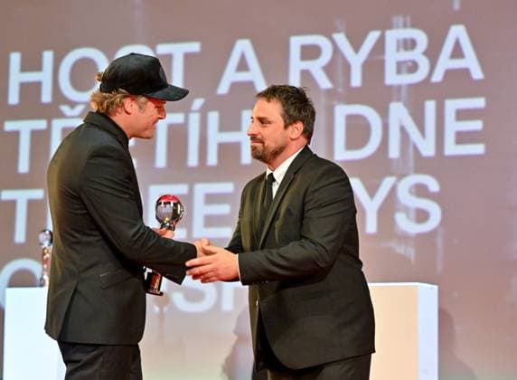 Dutch actor Guido Pollemans, left, receives the Best Actor Awards in the film The Guest and the Fish of the Third Day at the closing awards ceremony of the 58th Karlovy Vary International Film Festival, in Karlovy Vary, Czech Republic, on July 6, 2024. (CTKxPhoto OndrejxHajek) CTKPhotoP2024070604947  CTKPhotoP2024070604947