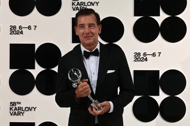 British actor Clive Owen poses in front the photo wall with his President s Award of Karlovy Vary International Film Festival after the closing awards ceremony of the 58th Karlovy Vary International Film Festival, in Karlovy Vary, Czech Republic, on July 6, 2024. (CTKxPhoto SlavomirxKubes) CTKPhotoP2024070605389  CTKPhotoP2024070605389