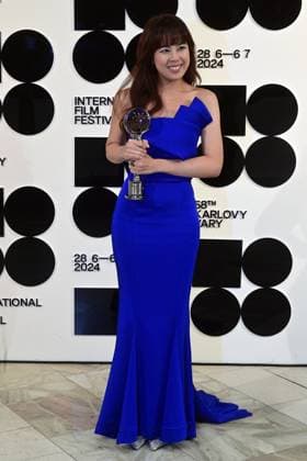 Singaporean director Nelicia Low poses in front the photo wall with her Best Director Award after the closing awards ceremony of the 58th Karlovy Vary International Film Festival, in Karlovy Vary, Czech Republic, on July 6, 2024. (CTKxPhoto SlavomirxKubes) CTKPhotoP2024070605505  CTKPhotoP2024070605505