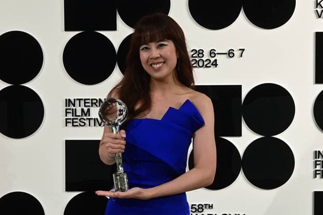 Singaporean director Nelicia Low poses in front the photo wall with her Best Director Award after the closing awards ceremony of the 58th Karlovy Vary International Film Festival, in Karlovy Vary, Czech Republic, on July 6, 2024. (CTKxPhoto SlavomirxKubes) CTKPhotoP2024070605506  CTKPhotoP2024070605506