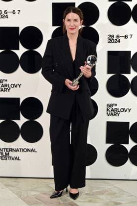 Norwegian actress Helga Guren poses in front the photo wall with her Best Actress Award after the closing awards ceremony of the 58th Karlovy Vary International Film Festival, in Karlovy Vary, Czech Republic, on July 6, 2024. (CTKxPhoto SlavomirxKubes) CTKPhotoP2024070605585  CTKPhotoP2024070605585