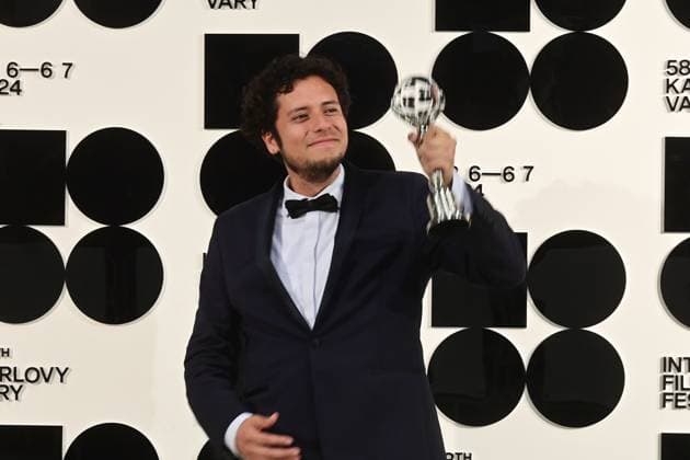 Peruvian director Paolo Tizon poses in front the photo wall with his Proxima Special Award for his documentary When the Night Came after the closing awards ceremony of the 58th Karlovy Vary International Film Festival, in Karlovy Vary, Czech Republic, on July 6, 2024. (CTKxPhoto SlavomirxKubes) CTKPhotoP2024070605745  CTKPhotoP2024070605745