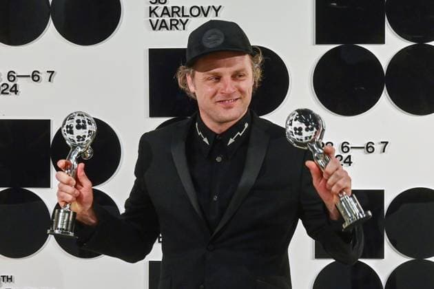 Dutch actor Guido Pollemans poses in front the photo wall with his Best Actor Award in the film The Guest and the Fish of the Third Day after the closing awards ceremony of the 58th Karlovy Vary International Film Festival, in Karlovy Vary, Czech Republic, on July 6, 2024. The second prize was awarded to Tony Kase for his co-actor in the same film. (CTKxPhoto SlavomirxKubes) CTKPhotoP2024070605780  CTKPhotoP2024070605780