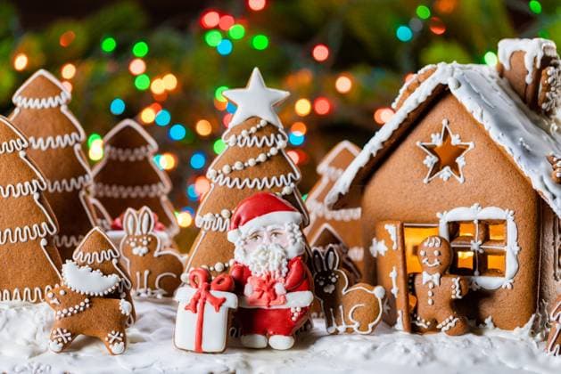 Gingerbread house christmas fir trees Santa Claus and gift cookies winter holiday celebration concept. Gingerbread house and trees ,model released, Symbolfoto