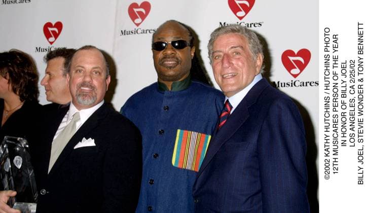 2002 KATHY HUTCHINS HUTCHINS PHOTO.12TH MUSICARES PERSON OF THE YEAR .IN HONOR OF BILLY JOEL.LOS ANGELES, CA 2 25 02.BILLY JOEL, STEVIE WONDER & TONY BENNETT. EDITORIAL USE ONLY Copyright: xx x khphotos301978