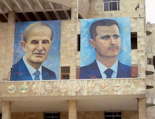 Presidents of Syria. Left: Hafez al-Asad (1930-2000), right: Basahr al-Assad (1965). Large portraits, Damascus, Syria. Presidents of Syria. Left: Hafez al-Asad (1930-2000), right: Basahr al-Assad (1965). Large portraits. Hamidie souk. Damascus. Picture took before the Civil War. Damascus Syria  Copyright: xKenaxImagesx 153-44190