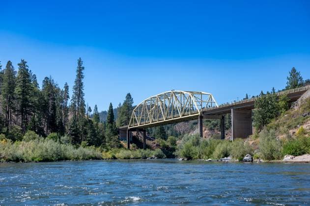 Galice Road-Rogue River Yellow Bridge just past the Hellgate Canyon on the wild and scenic Rogue River Galice Road-Rogue River Yellow Bridge just past the Hellgate Canyon on the wild and scenic Rogue River . High quality photo Copyright: xZoonar.com STEVENxWHITEx 21804868