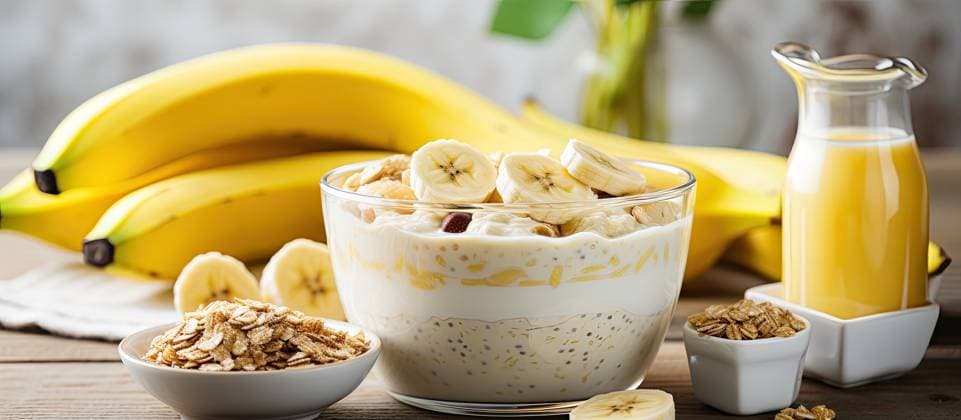 Breakfast consisting of bananas mixed into cooked oats served in a bowl of the color yellow accompanied by a glass containing milk placed on the table Breakfast consisting of bananas mixed into cooked oats served in a bowl of the color yellow accompanied by a glass containing milk placed on the table Copyright: xZoonar.com YadavxDharmendrax 21840448