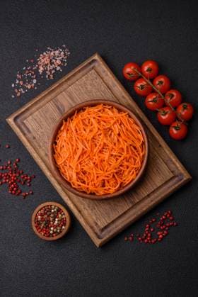 Tasty spicy Korean carrot with spices and herbs on a dark concrete background Tasty spicy Korean carrot with spices and herbs on a dark concrete background. Asian food Copyright: xZoonar.com TetianaxChernykovax 21860852
