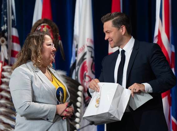 July 11, 2024, Montreal, Pq, Canada: Conservative Leader Pierre Poilievre receives a gift from National Chief Cindy Woodhouse Nepinak after speaking to the Assembly of First Nations, Thursday, July 11, 2024 in Montreal. Montreal Canada  - ZUMAc35_ 20240711_zaf_c35_009 Copyright: xRyanxRemiorzx