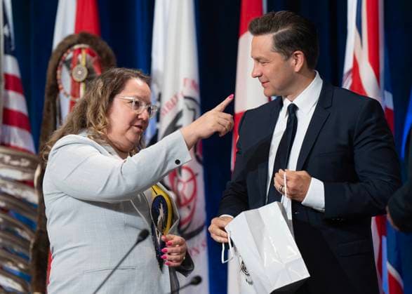 July 11, 2024, Montreal, Pq, Canada: Conservative Leader Pierre Poilievre chats with National Chief Cindy Woodhouse Nepinak after speaking to the Assembly of First Nations, Thursday, July 11, 2024 in Montreal. Montreal Canada  - ZUMAc35_ 20240711_zaf_c35_010 Copyright: xRyanxRemiorzx