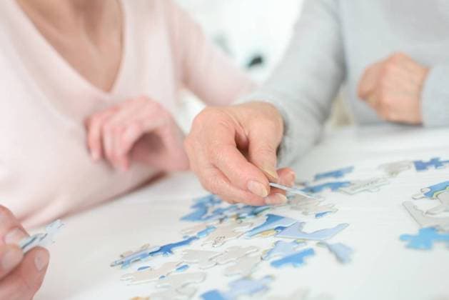 hands are doing a puzzles ,model released, Symbolfoto