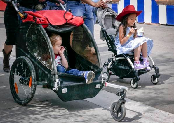 July 14, 2024, Calgary, Ab, CANADA: A young cowgirl enjoys an ice cream during the final day of the Calgary Stampede in Calgary, Sunday, July 14, 2024. Calgary CANADA  - ZUMAc35_ 20240714_zaf_c35_013 Copyright: xJeffxMcintoshx