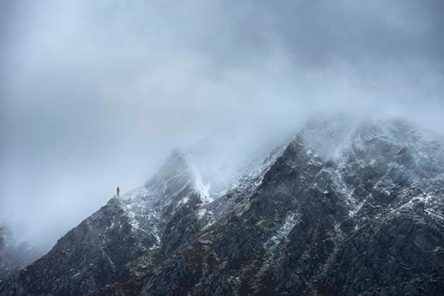 Stunning detail landscape images of snowcapped Pen Yr Ole Wen mountain in Snowdonia during dramatic Winter storm ,model released, Symbolfoto