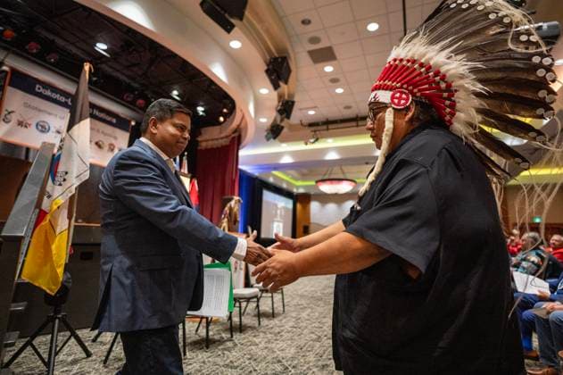 July 15, 2024, Whitecap Dakota Nation, Sk, Canada: Gary Anandasangaree, Minister of Crown-Indigenous Relations, left, shakes hands with Chief Raymond Brown, Canupawakpa during a ceremony where the Government of Canada delivered a formal apology to the 9 Dakota and Lakota First Nations in Canada in Whitecap Dakota Nation, Saskatchewan on Monday, July 15, 2024. Whitecap Dakota Nation Canada - ZUMAc35_ 20240715_zaf_c35_030 Copyright: xLiamxRichardsx