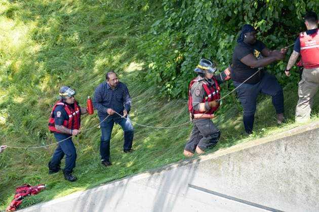 July 16, 2024, Toronto, On, Canada: Drivers stranded due to flood waters blocking the Don Valley Parkway are rescued by fire crews following heavy rain in Toronto, on Tuesday, July 16 2024. Toronto Canada  - ZUMAc35_ 20240716_zaf_c35_038 Copyright: xArlynxMcadoreyx