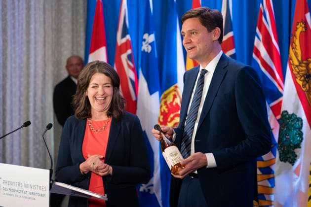 July 16, 2024, Halifax, Ns, Canada: British Columbia Premier David Eby, right, gifts a bottle of B.C. wine to Alberta Premier Danielle Smith while speaking to reporters at the Council of the Federation meetings in Halifax on Tuesday, July 16, 2024. Halifax Canada  - ZUMAc35_ 20240716_zaf_c35_058 Copyright: xDarrenxCalabresex