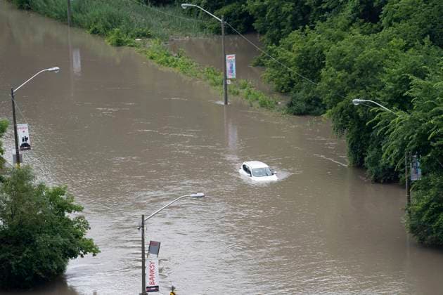 July 16, 2024, Toronto, On, Canada: A car is partially submerged in flood waters in the Don Valley following heavy rain in Toronto, on Tuesday, July 16 2024. Toronto Canada  - ZUMAc35_ 20240716_zaf_c35_113 Copyright: xArlynxMcadoreyx