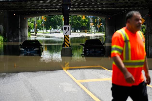 July 16, 2024, Toronto, On, Canada: A tow truck operator responds to submerged vehicles at an underpass at Parkside Drive and Lake Shore Blvd., after heavy rain caused flooding, in Toronto on Tuesday, July 16, 2024. Toronto Canada  - ZUMAc35_ 20240716_zaf_c35_117 Copyright: xChristopherxKatsarovx