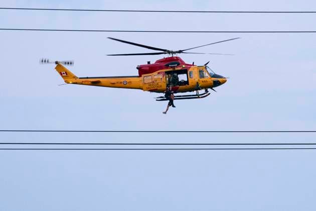 July 16, 2024, Toronto, On, Canada: A Royal Canadian Air Force Search and Rescue helicopter crew rescues a man from Etobicoke Creek following heavy rain in Toronto on Tuesday, July 16, 2024. Torrential rain that pummelled Toronto flooded a major highway, several thoroughfares and a key transit hub on Tuesday öÄÃ¬ requiring emergency crews to rescue people from stranded cars and other spaces öÄÃ¬ while large parts of the city were left without power. Toronto Canada  - ZUMAc35_ 20240716_zaf_c35_149 Copyright: xArlynxMcadoreyx